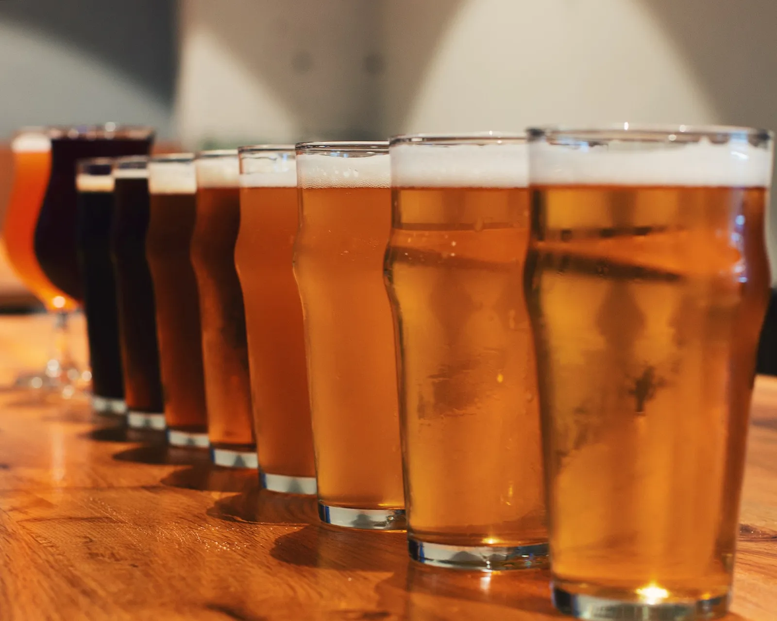 A row of beers lined up on the bar