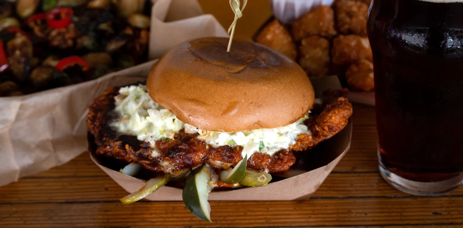 A smash burger and fries on the bar