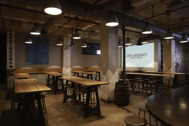 The showroom with long tables and a screen