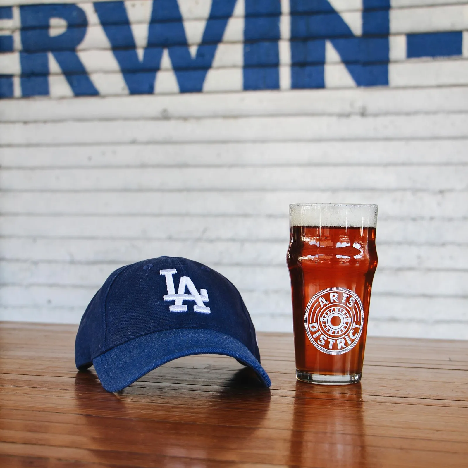 A Dodgers cap and a pint