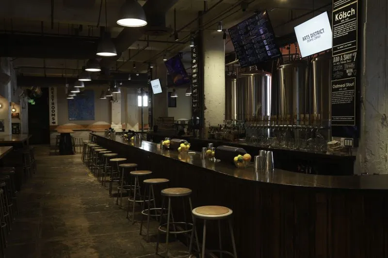 The main bar with the brewhouse tanks behind it