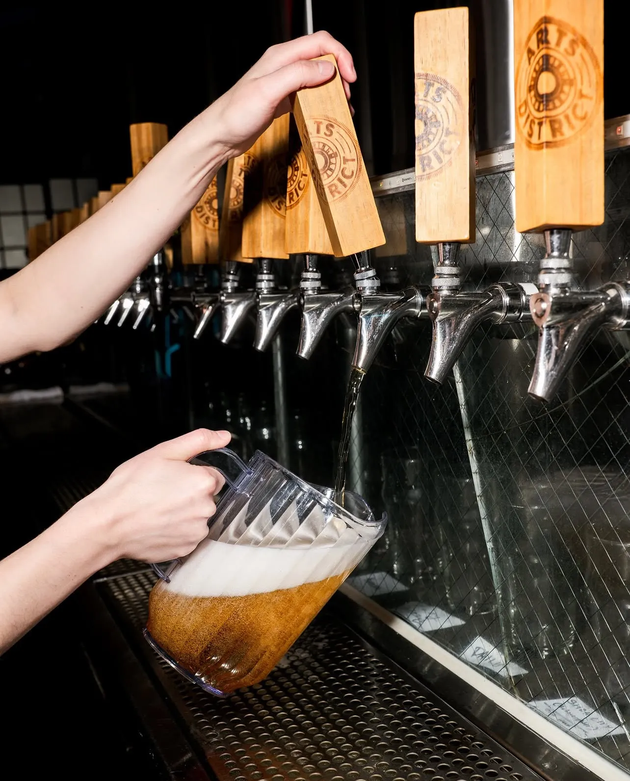 A pint being pulled at the main bar