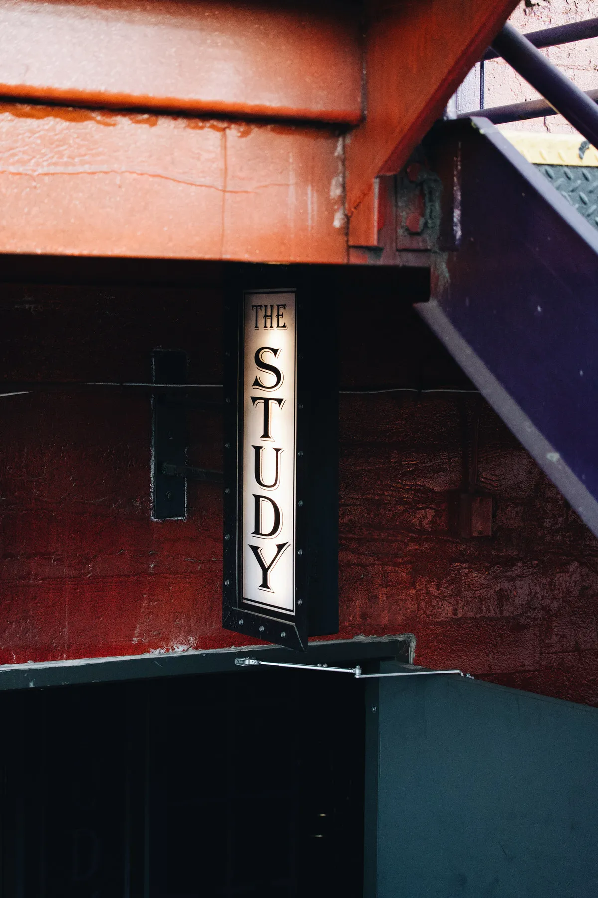 The Study sign on the brick outside