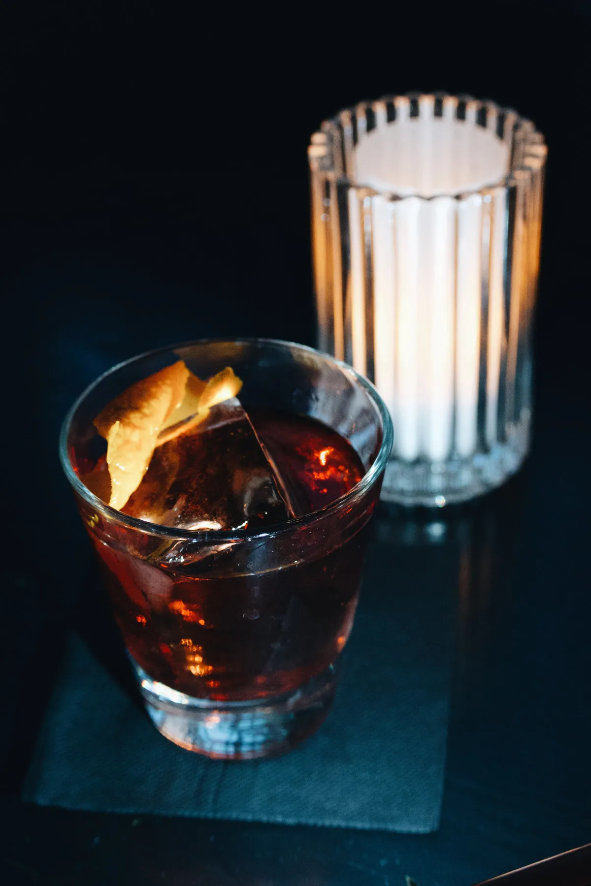 An old fashioned with a flamed orange peel